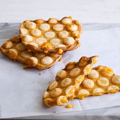 three pieces of food sitting on top of a paper towel