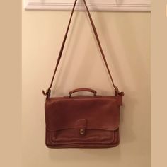 Saddle Brown. 16 Inches Length X 4 Inches Width X 10.5 Height Everyday Brown Coach Satchel, Vintage Coach Messenger, Brown Coach Saddle Bag With Removable Pouch, Retro Coach Brown Bag, Brown/black Coach Bag, Brown Coach Bags With Silver-tone Hardware, Coach Accessories, Saddle Brown, Laptop Cases