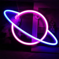 a neon sign that is glowing in the dark