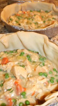 three pie pans filled with food on top of a kitchen counter next to each other