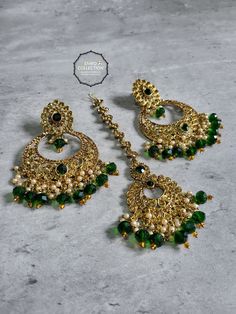 Overview Elevate your style with our stunning Green Maang Tikka and Earrings set, perfect for weddings, parties, and special occasions. This exquisite set is designed to make you feel special and stand out in any crowd. Shop now at Emro Collection! Product Features Elegant Design Our Green Maang Tikka and Earrings set features a sophisticated design that combines traditional elements with modern flair. The intricate detailing and vibrant green color make it a standout piece. High-Quality Materia Green Maang Tikka, Dark Green Earrings, Maang Tikka, Pakistani Jewelry, Green Jewelry, Matching Jewelry, Green Outfit, Green Earrings, Stunning Earrings