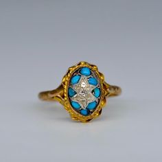 A gorgeous antique turquoise and diamond ring. This early bombe style ring is set with cabochon turquoises and a centrally star set diamond.  All presented in a beautifully decorated yellow gold mount.   UK ring size N1/2 Vintage Yellow Gold Turquoise Cabochon Ring, Antique Yellow Gold Turquoise Cabochon Ring, Heirloom Blue Oval Cabochon Turquoise Ring, Antique Style Turquoise Wedding Ring With Cabochon, Antique Turquoise Cabochon Ring For Wedding, Vintage Oval Cabochon Turquoise Ring For Anniversary, Vintage Turquoise Oval Cabochon Ring For Anniversary, Antique Blue Turquoise Ring For Anniversary, Vintage Blue Cabochon Turquoise Ring