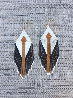 two pairs of beaded earrings with tassels