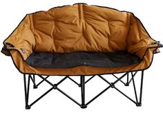 a dog bed that is sitting on top of a metal frame with an orange cover over it