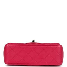 This Mini Top Handle Rectangular flap bag is in fuschia lambskin with light gold tone hardware and has a front flap with signature CC turnlock closure, rear half moon pocket, dark and fuschia top handle and single interwoven fuschia leather and light gold tone chain link shoulder/crossbody strap.The interior is lined in fuschia leather and features a zipper pocket with Chanel pull and an open pocket below.Collection: 2021 (RFID)Origin: FranceCondition: Pre-owned; Mint - This bag retains its shape. The exterior leather is clean with no signs of wear except a few small press marks to back exterior pocket from chain strap. There's no plastic on the hardware but no signs of scratching. The interior leather is clean with no signs of wear.Accompanied by: Chanel box, Chanel dustbag, RFID chip Mea Designer Rectangular Flap Bag With Cc Turnlock Closure, Pink Shoulder Bag With Turn-lock Closure For Evening, Pink Leather Shoulder Bag With Cc Turnlock Closure, Pink Leather Double Flap Bag, Designer Pink Flap Bag For Formal Occasions, Luxury Pink Formal Flap Bag, Luxury Pink Double Flap Bag, Luxury Pink Flap Bag, Pink Formal Bags With Cc Turnlock Closure