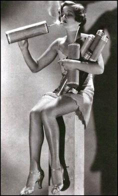 a woman sitting on top of a stool holding a can