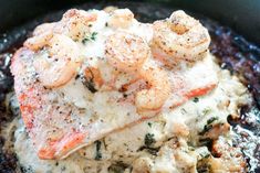 shrimp and grits are served in a skillet