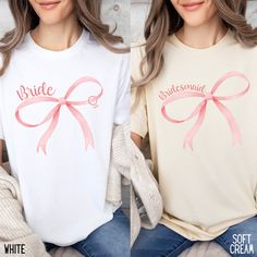 two women wearing matching shirts with pink bows