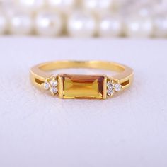 Baguette Cut Citrine Engagement Ring, Cluster Diamond Statement Ring, 10K Solid Gold Women Jewelry, Art Deco Ring, Personalised Gift For Her Description: Main Stone - Citrine ( Lab Created ) Stone Size - 8 x 4 MM Stone color - Yellow Stone shape - Baguette Stone Birth Month: November Second Stone: CZ Diamond Stone Shape: Round Stone Color: Colorless Stone cut - Brilliant Cut Finishing- Excellent feel free to contact me if you have any questions  Gemstone color may slightly vary from listed image Citrine Wedding Band, Mother Of The Bride Jewelry, Yellow Gemstone Ring, Citrine Engagement Ring, Engagement Ring Cluster, Citrine Ring Engagement, Ring Cluster, Statement Rings Diamond, Yellow Gemstones