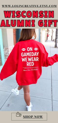 the back of a woman's red sweatshirt that reads wisconsinn, alumini gift