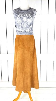 "Vintage Avon tan brown suede leather aline long maxi skirt Measurements...taken flat -marked size: vintage 7/8 -across waist: 13\" -across hip: 18\" -length: 33\" Features... -light brown genuine suede leather -long flowy silhouette -back zipper closure -fully lined -Avon Condition... -excellent vintage condition -minor suede wear" Skirt Measurements, Long Maxi Skirt, Long Maxi Skirts, Faded Denim, Vintage Avon, Long Maxi, Brown Suede, Tan Brown, Suede Leather