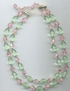 During the heyday of vintage Czech crystal manufacturing, their crystals could take on Swarovski crystals one-on-one without backing down. This beautiful double-stranded vintage necklace showcases these highest-quality Czech crystals. There are 10 mm faceted bicone crystals in the color rosaline aurora borealis, alternated with 16 x 9 mm faceted oval crystals in the color chrysolite (which is a bit greener than Swarovski chrysolite). The crystals are in mint condition. The shorter strand of this Oval Beads, Czech Crystal, Vintage Crystal, Aurora Borealis, Artisan Jewelry, Vintage Necklace, Crystal Necklace, Jewelry Inspiration, Pink And Green