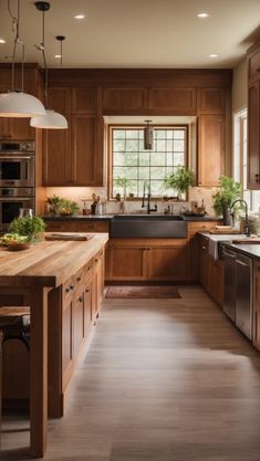 a large kitchen with wooden cabinets and stainless steel appliances, along with hardwood flooring