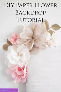 some paper flowers are on top of a white chair with the words diy paper flower backdrop