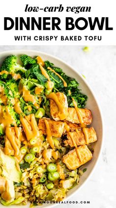 a white bowl filled with broccoli and tofu covered in sauce next to the words, low carb vegan dinner bowl with crispy baked tofu