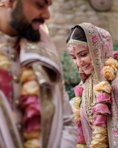 the bride and groom are smiling together