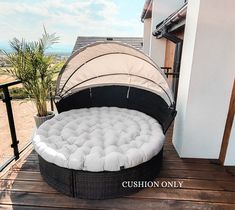 an outdoor day bed on a deck with the words cushion only written below it in white