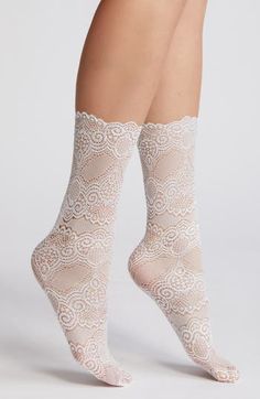 Intricate lace socks with scalloped cuffs add a romantic, vintage-inspired detail to any ensemble. Nylon/spandex Machine wash, line dry Imported Elegant Fitted Mid-calf Socks, Fitted White Socks With Lace Trim, Elegant Fitted White Socks, Elegant Stretch Mid-calf Legwear, White Stretch Lace Hosiery, Lace Trim Hosiery, Elegant Fitted Lace Socks, Elegant Stretch Stockings With Lace Trim, Elegant White Socks For Spring