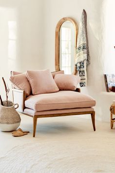 a living room filled with furniture and mirrors