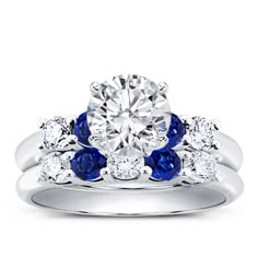 a diamond and blue sapphire engagement ring