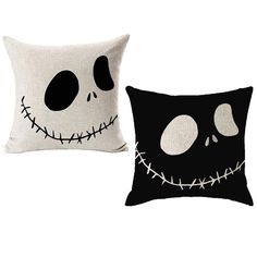 two pillows with black and white designs, one has a skull face on the front