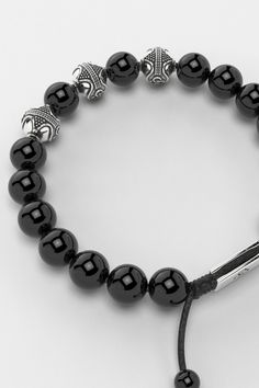 Introducing the Premium Bracelet, embodying the eternal quest for personal growth and self-realization. Its design, inspired by an infinite symbol in three dimensions, represents the mind, body, and spirit's interconnected journey. This piece symbolizes the relentless pursuit of one's true purpose, reminding us that in every mindful step lies the essence of life and the path to becoming the person we aspire to be. All our stones are chosen by hand to satisfy AAA quality standards. They are natur Modern Black Hand-strung Bracelets, Modern Black Hand-strung Bracelet, Modern Black Bracelets With 8mm Beads, Modern Black Bracelet With 8mm Beads, Polished Black Bracelets, Luxury Adjustable Bracelets With Black Beads, Modern Gemstone Beads Bracelets, Luxury Black Jewelry With 8mm Beads, Modern Adjustable Onyx Bracelet