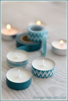 several tea lights sitting on top of a table