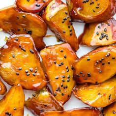 cooked potatoes with sesame seeds on a white plate