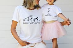 "Raising Wildflowers  Little Wildflower Matching Shirts, Mommy And Me Outfit, Matching Mommy And Me Shirt, Mothers Day Gift From Daughter Join the ranks of stylish comfort with our newest line of Bella Canvas shirts! Made from 100% recycled materials, these simple and trendy shirts are perfect for any occasion. In addition, our high-quality vinyl printing and heat pressing process ensure that your shirt will last through all the wear and tear you can throw at it. So ditch those scratchy, faded old band shirts and join the Tee Goddess revolution today!   PRODUCT DETAILS Solid Colors: 100% combed and ring-spun cotton Heather Colors: 90% combed and ring-spun cotton, 10% polyester HOW TO ORDER 1️⃣ Select \"Shirt Size\". 2️⃣ Select \"Shirt Color\". 3️⃣Select quantity. 4️⃣ Click \"Add To Cart\". Bebe T Shirt, Gigi Shirts, Mommy And Me Shirt, Mothers Day Gifts From Daughter, Daughters Shirt, Mommy And Me Outfits, Matching Tees, To Infinity And Beyond, Mother And Daughter