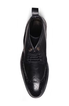 Brogue perforations and a wingtip toe add vintage distinction to a luxe lace-up boot rendered in polished leather. Leather upper and lining/rubber sole Imported Asian & Pacific Islander Owned/Founded Pacific Islander, Concert Looks, Flip Flop Slippers, Sweaters And Leggings, Working Woman, Comfortable Sandals, Black Fits, Handbag Backpack