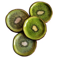 three kiwi slices sitting on top of each other