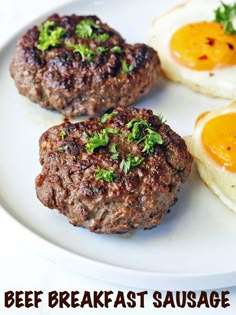 three hamburger patties on a plate with eggs