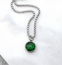 《《  FOR YOUR JOURNEY COLLECTION  》》 THE DETAILS The "SILVER EMERALD COIN" Necklace is designed with an incredibly detailed Silver Stainless Steel Open Ring Bezel Pendant, with a luxurious lightweight Faceted Cushion Cut Emerald Cubic Zirconia Stone, suspended from a Silver Stainless Steel Box Chain available in your choice of length! GEMSTONE BENEFITS EMERALD CUBIC ZIRCONIA: Known as the stone of "ROYALTY, SUCCESS, & LOVE", often worn for its abilities to bring wealth & abundance, while encourag Necklace Pendant For Men, Necklace Length Chart, Domestic Bliss, Wealth Abundance, Silver Chain For Men, Pendant For Men, Black Two Piece, Chain For Men, Coin Pendant Necklace