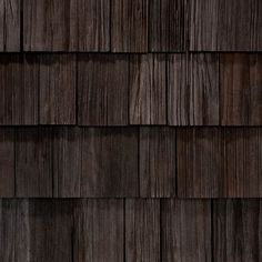 a close up view of the dark wood shingles