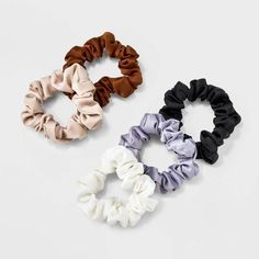 This 5-Piece Satin Mini Hair Twister Set from A New Day™ includes five round scrunchies in solid colors to pair well with a variety of outfits. Made from soft and smooth satin covering material, they come with an internal elastic to secure your hairdos in comfy style without tugging. You can use them to secure a top knot, ponytail and more. 

A New Day™: Style that goes wherever you do. Top Knot Ponytail, Hair Twisters, Knot Ponytail, Split Dyed Hair, Hair Elastics, Comfy Fashion, Top Knot, Hair Tools, A New Day