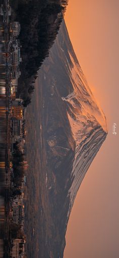 the mountain is covered in snow and it looks like something from another time lapse