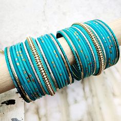 Beautifully designed bangles for any occasion. South asian bracelets come in a variety of styles, colors, and finishes. We at Banglez take creating the perfect bangle set for you to another level! You could say helping you find your favorite stack of bangles as one of our greatest missions. This bangle set was curated in house by one of our talented team members. We hope you love them as much as we do! Festive Stackable Bangle Bracelets, Bohemian Stackable Bangle For Party, Stackable Bohemian Bangle For Party, Bohemian Stackable Wedding Bracelets, Festive Stackable Beaded Bangle Bracelets, Festive Stackable Bracelets For Festivals, Stackable Festival Bangles, Blue Bohemian Bangle For Festive Occasions, Stackable Bangle Bracelets For Festivals