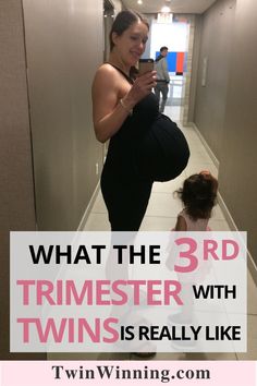 a pregnant woman and her child in the hallway text reads, what the 3rd trimester with twins really like