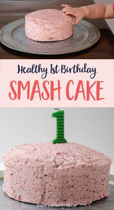 a cake with pink frosting sitting on top of a metal pan next to a child's hand