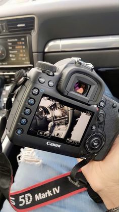 a person holding up a camera in their hand