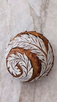 a loaf of bread sitting on top of a marble counter