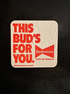 this bud's for you sticker is on a black surface