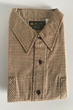 Deadstock John Blair Men Shirt Brown Checked Button Up Farmers Shirt XXL An Amazing vintage garment fully preserved with the original packaging. Love the carmel brown gingham and the ultra pointed Dickey Collar. Condition - Brand New Size -XXL Shoulder - 19.5"  Sleeve length 23.5 Chest- 48" Length- 30.5" Garments are measured while laying flat. Garments are not laundered prior to shipping. It is highly recommended that you launder the items to remove any residual perfumes and detergents from the Dickey Collar, Carmel Brown, Brown Gingham, Farmer Shirt, Men Shirt, Gingham, Button Up, Mens Shirts, Sleeve Length