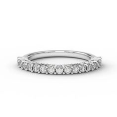 a white gold wedding band with five round cut diamonds on the top and bottom half