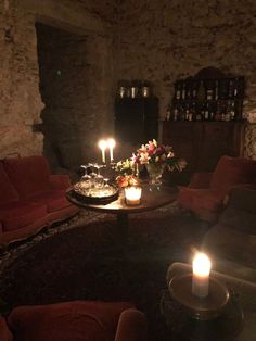 a living room with candles on the coffee table