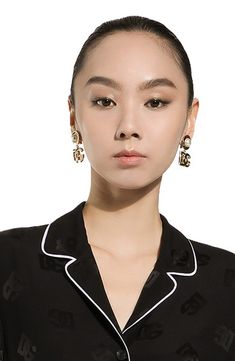 Bring the Italian label's signature glamour to any look with sleek drop earrings flaunting the iconic interlocking monogram and lustrous imitation pearls. Clip-on style Goldtone plate/plastic imitation pearl Made in Italy Black Pearl Earrings For Formal Occasions, Luxury Earrings For Workwear, Interlocking Monogram, Dg Logo, Clip On Earrings, Dolce And Gabbana, Gold Tones, Top Brands, Nordstrom