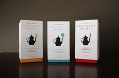 three boxes with different types of tea sitting on top of a black table next to each other