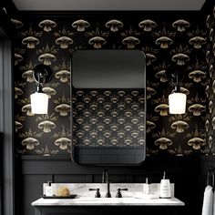 a bathroom with black and gold wallpaper, two sinks and a large mirror above it