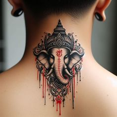 an elephant head tattoo on the back of a woman's neck, with blood dripping from it