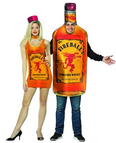 a man and woman dressed up as two people holding a bottle of fireball cider